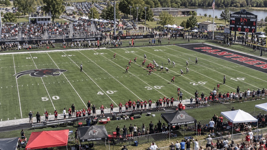 Crowd around a stadium field on game day