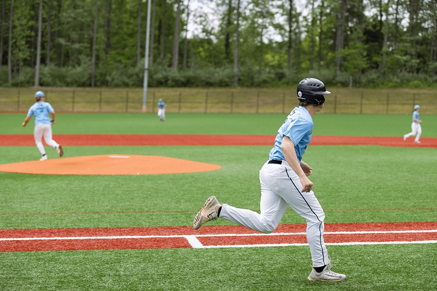 Young baserunner rounding first