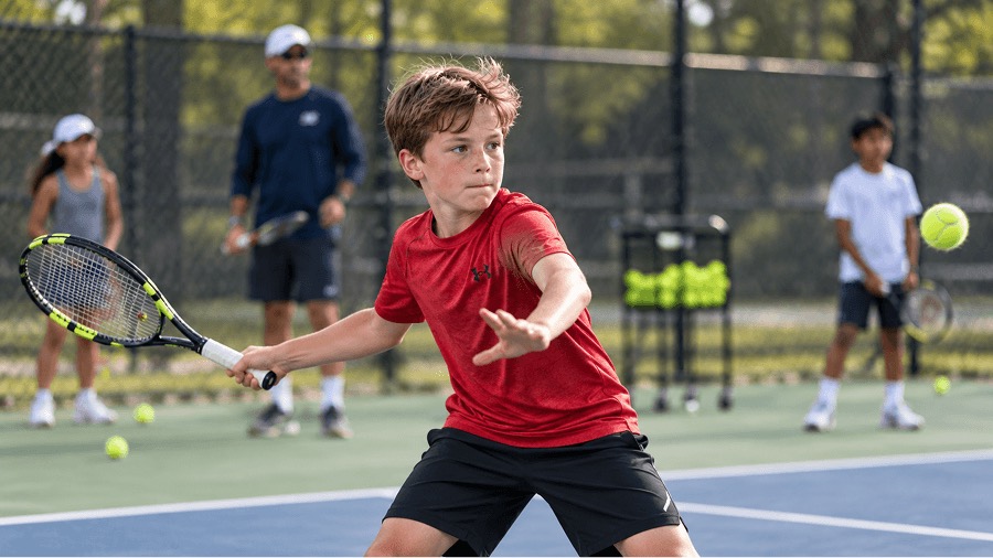 Junior tennis player at the net